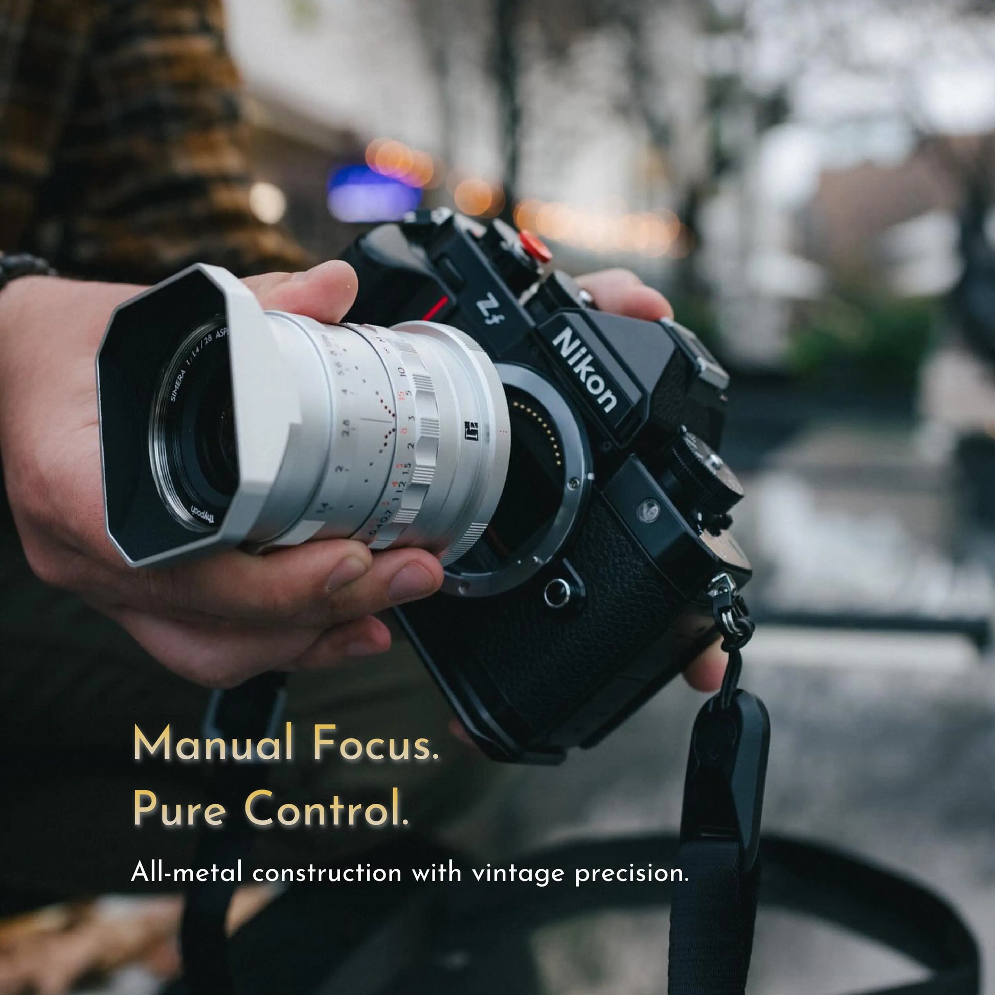 Simera 28mm f/1.4 manual camera lens mounted on Nikon Z with vintage-style focus tab and large aperture for Fujifilm-X, Canon-RF, Sony-E, Nikon-Z, Leica-M mounts.